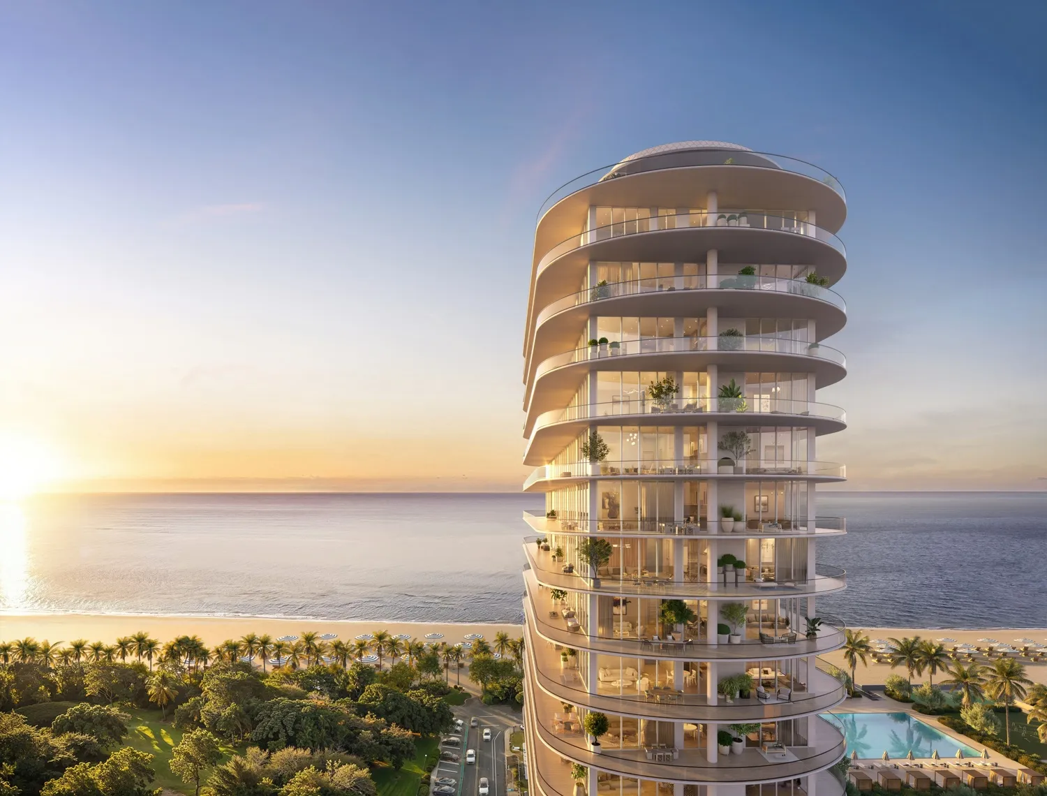 72 Carlyle Miami Beach Residences — la torre completa al atardecer, vista desde el parque frente al mar