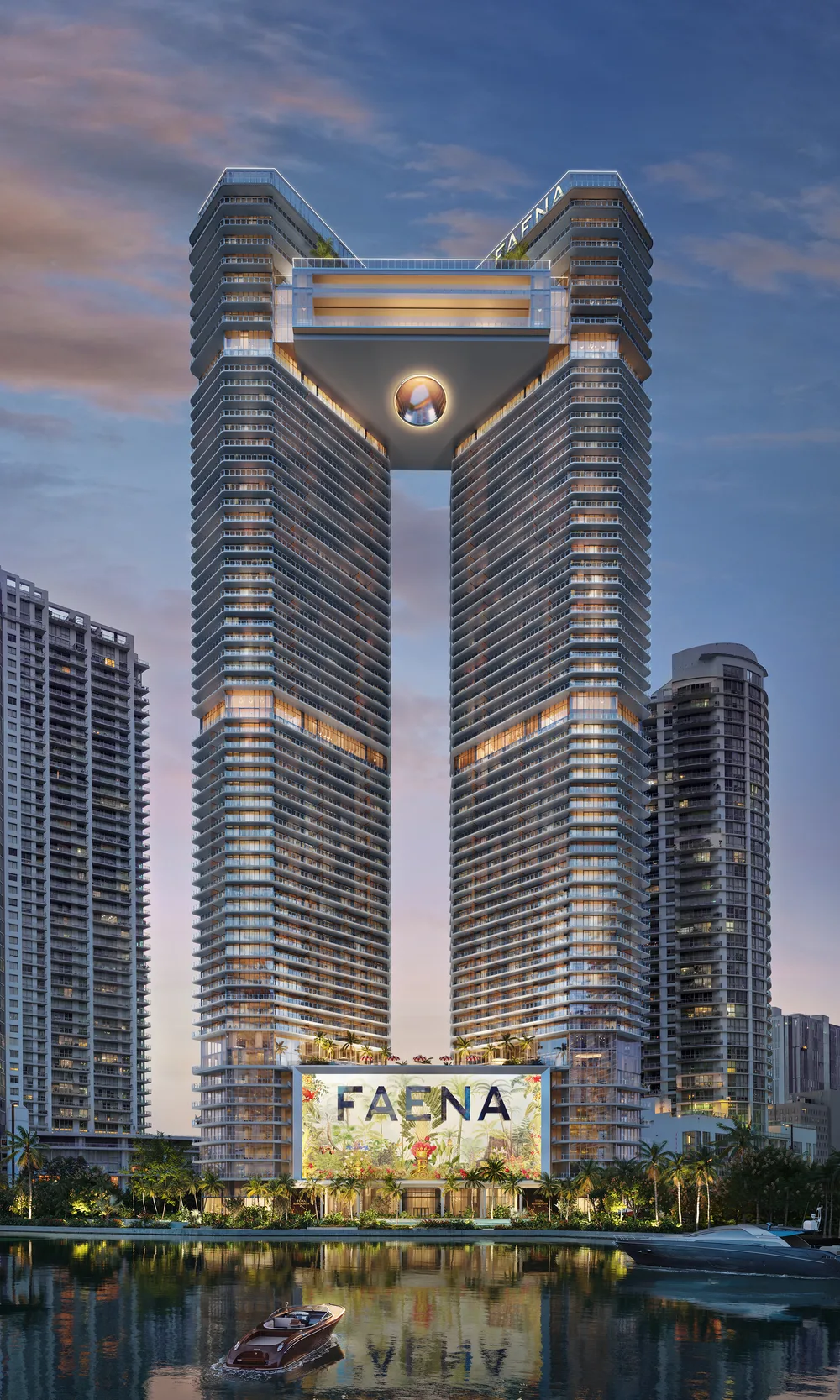 Faena Residences Miami visto desde el agua al atardecer, silueta completa de las dos torres conectadas por el Sky Bridge, con un yate amarrado en primer plano