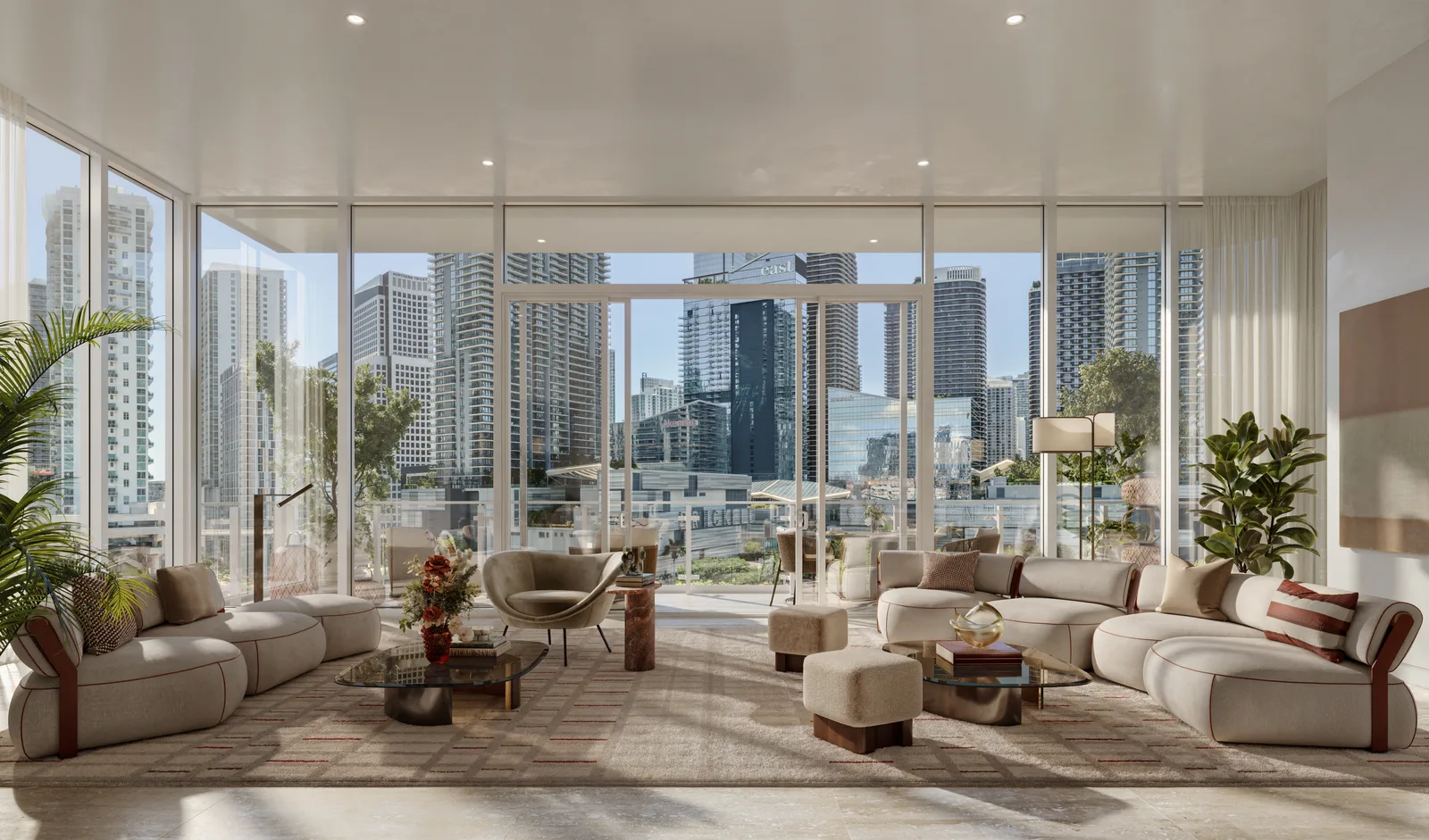 Sala y comedor de una River Loft con ventanales de piso a techo y vista al skyline de Brickell