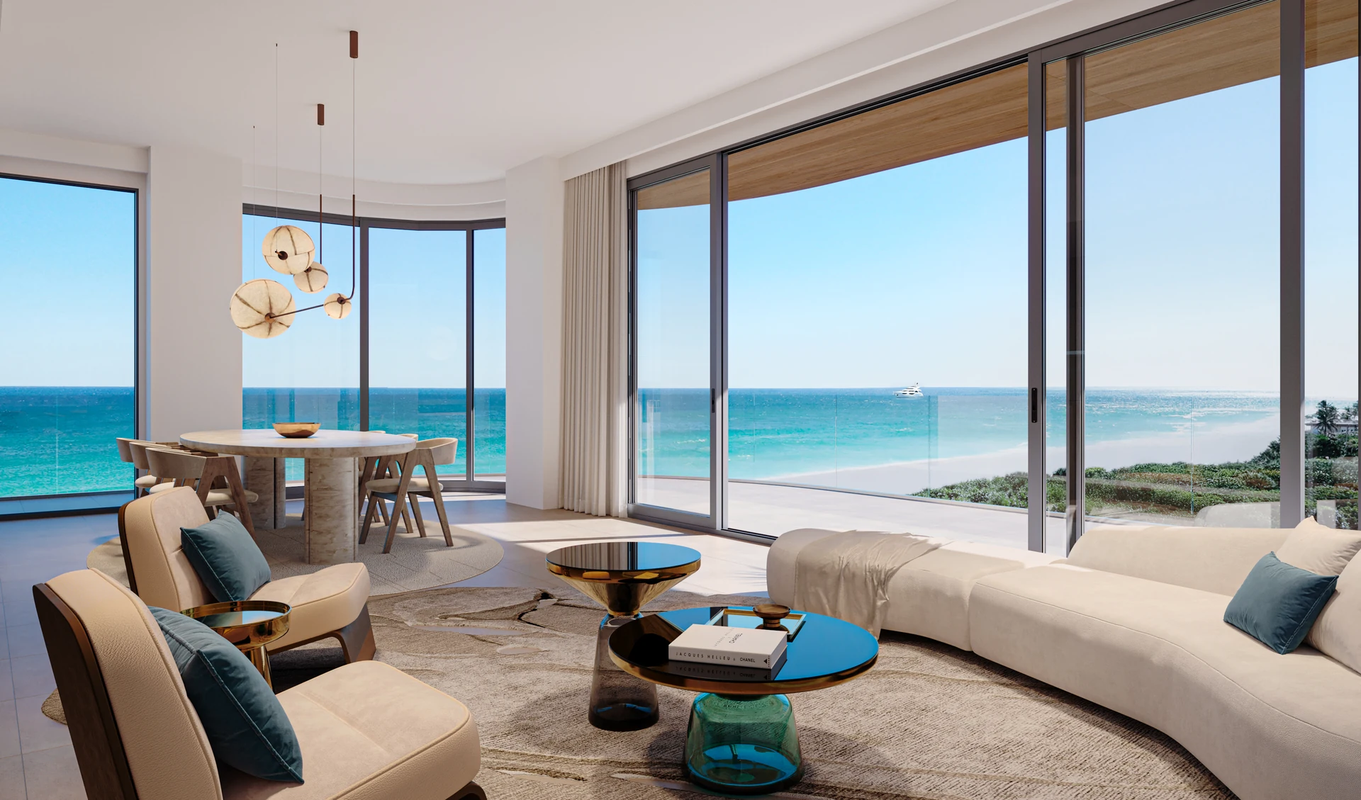 Hollywood Moon — sala y comedor de una residencia con sofá curvo y ventanales de piso a techo abiertos al mar y a la duna