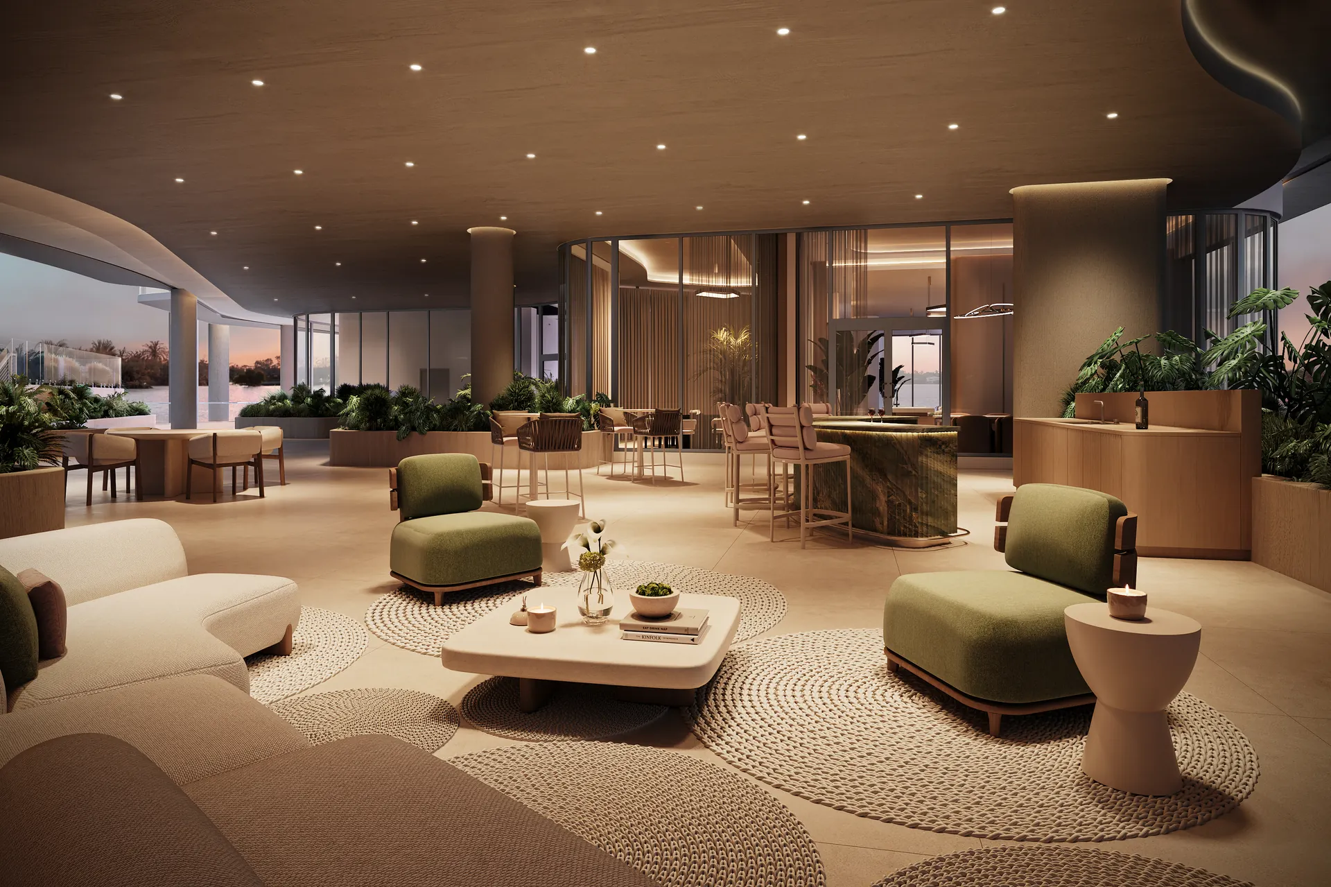 Hollywood Moon — salón social con butacas verdes, mesas bajas, jardineras interiores y una barra al fondo
