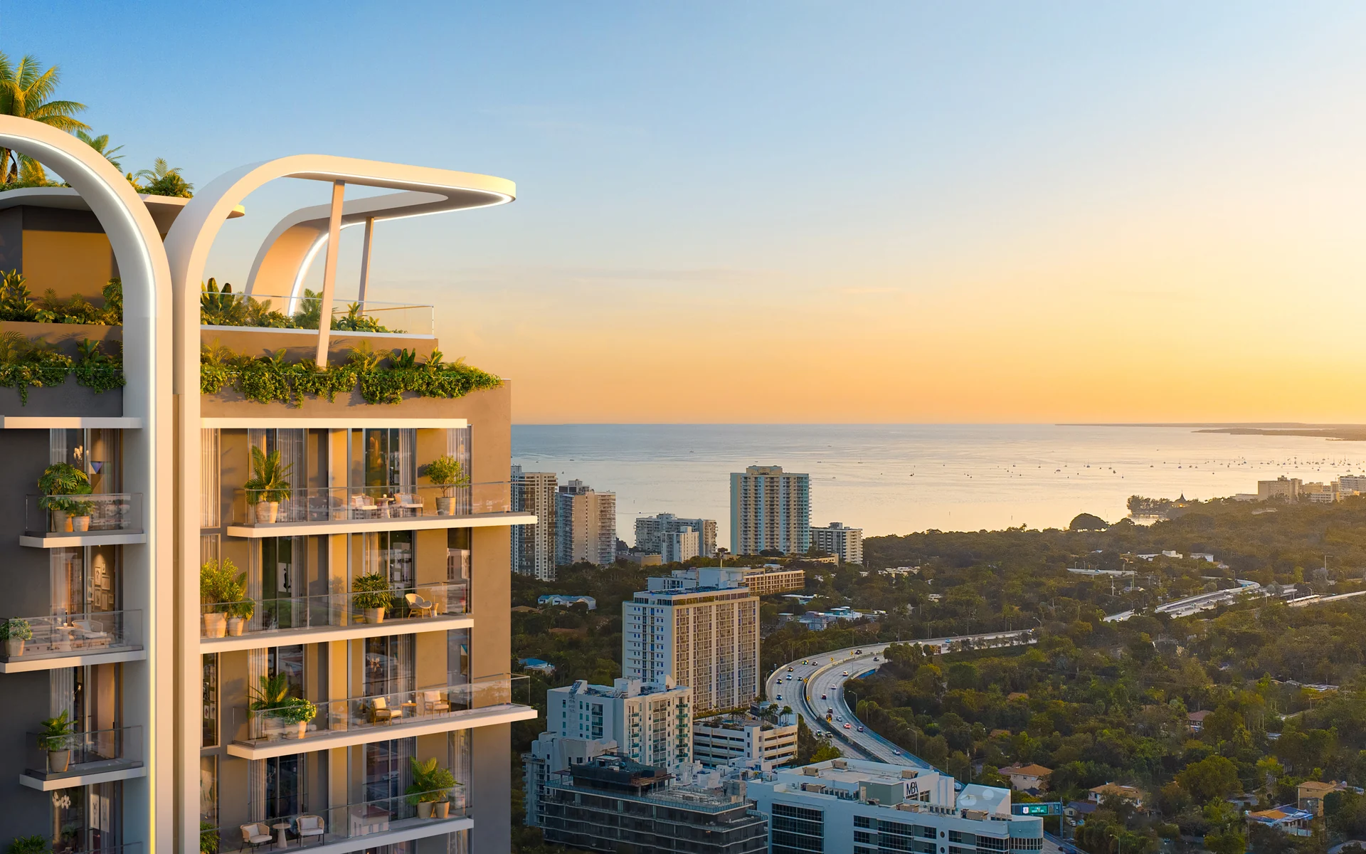 House of Wellness — fachada al atardecer con el logotipo iluminado y balcones sobre Brickell