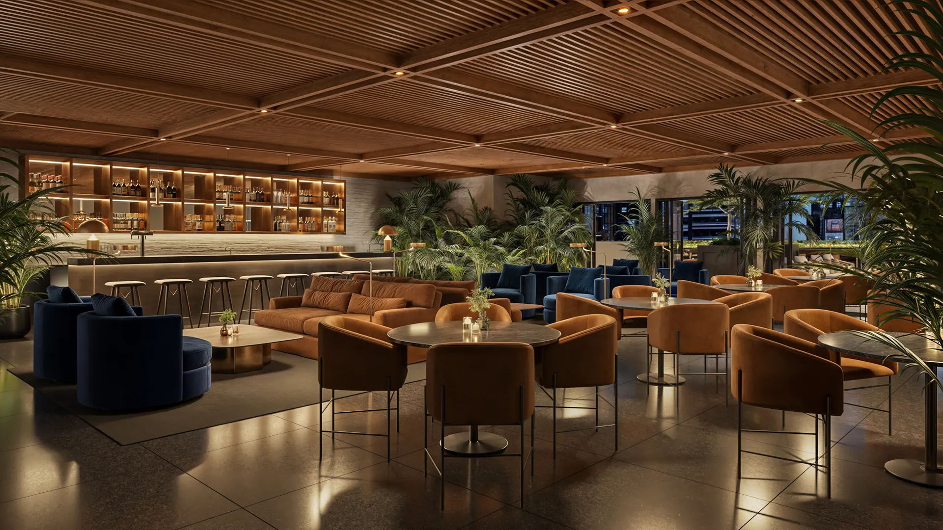 Millux Place — bar y lounge con barra iluminada, sofás en tono azul y naranja