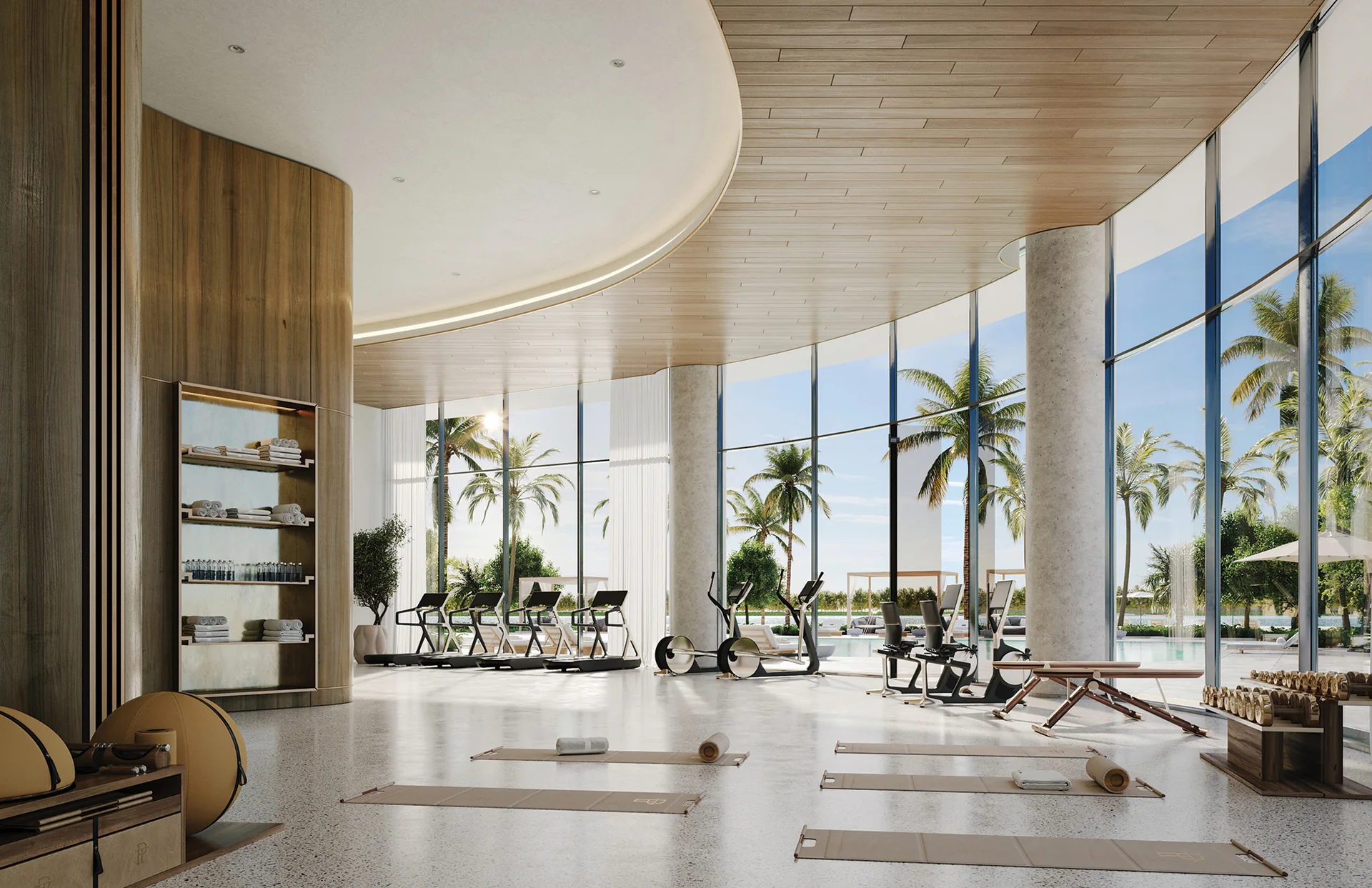 One Park Tower — gimnasio con ventanal curvo de piso a techo y zona de yoga
