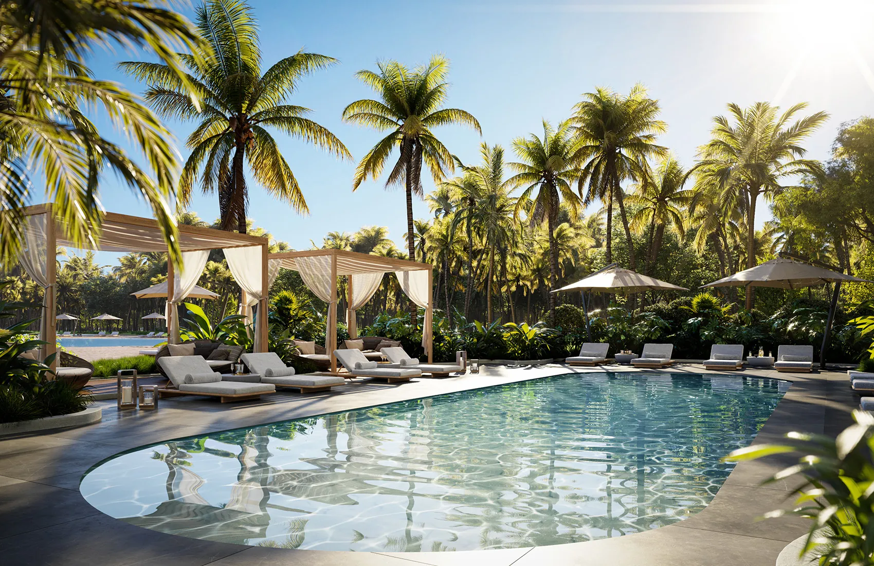 One Park Tower — piscina rodeada de palmeras, camastros y sombrillas