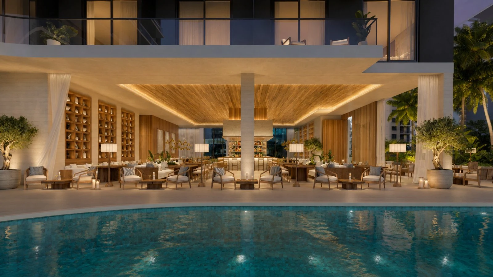 One Twenty Brickell — piscina estilo resort con salón cubierto, palmeras y camastros