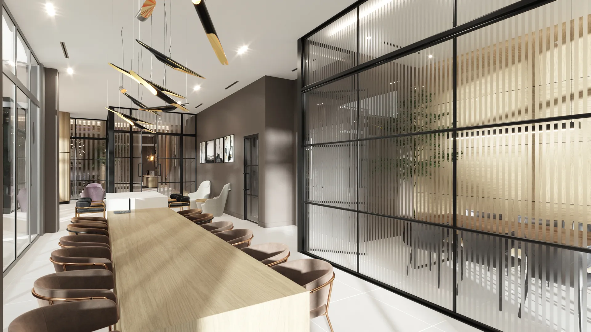 River District 14 — espacio de coworking con una mesa comunitaria larga de madera, sillas tapizadas, lámparas escultóricas y mamparas de vidrio con listones que separan las salas de reunión