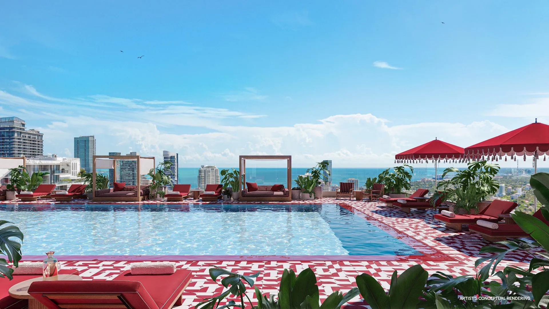 The Standard Residences Brickell — piscina de la azotea con sombrillas rojas y vista a la bahía de Biscayne