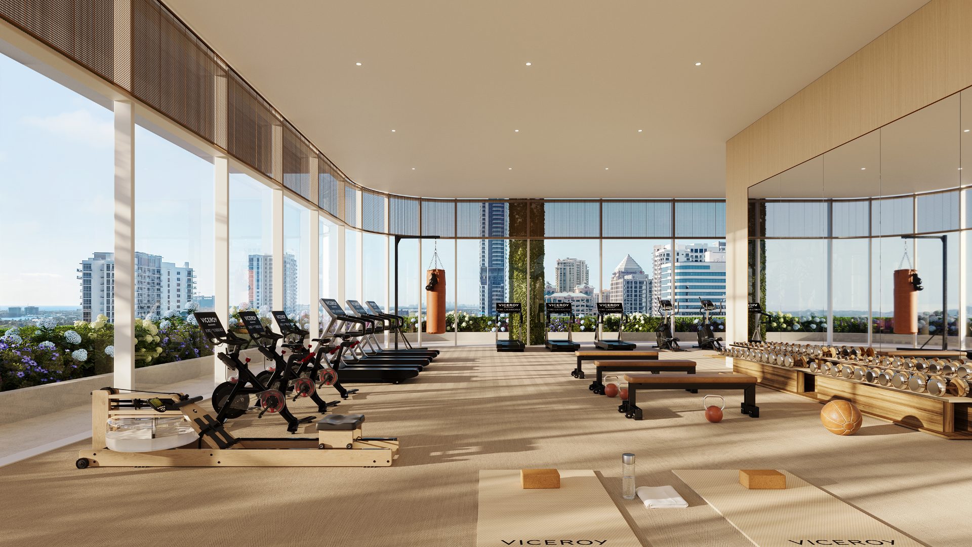 Viceroy Brickell — gimnasio con máquinas de cardio y ventanales de piso a techo con vista a la ciudad
