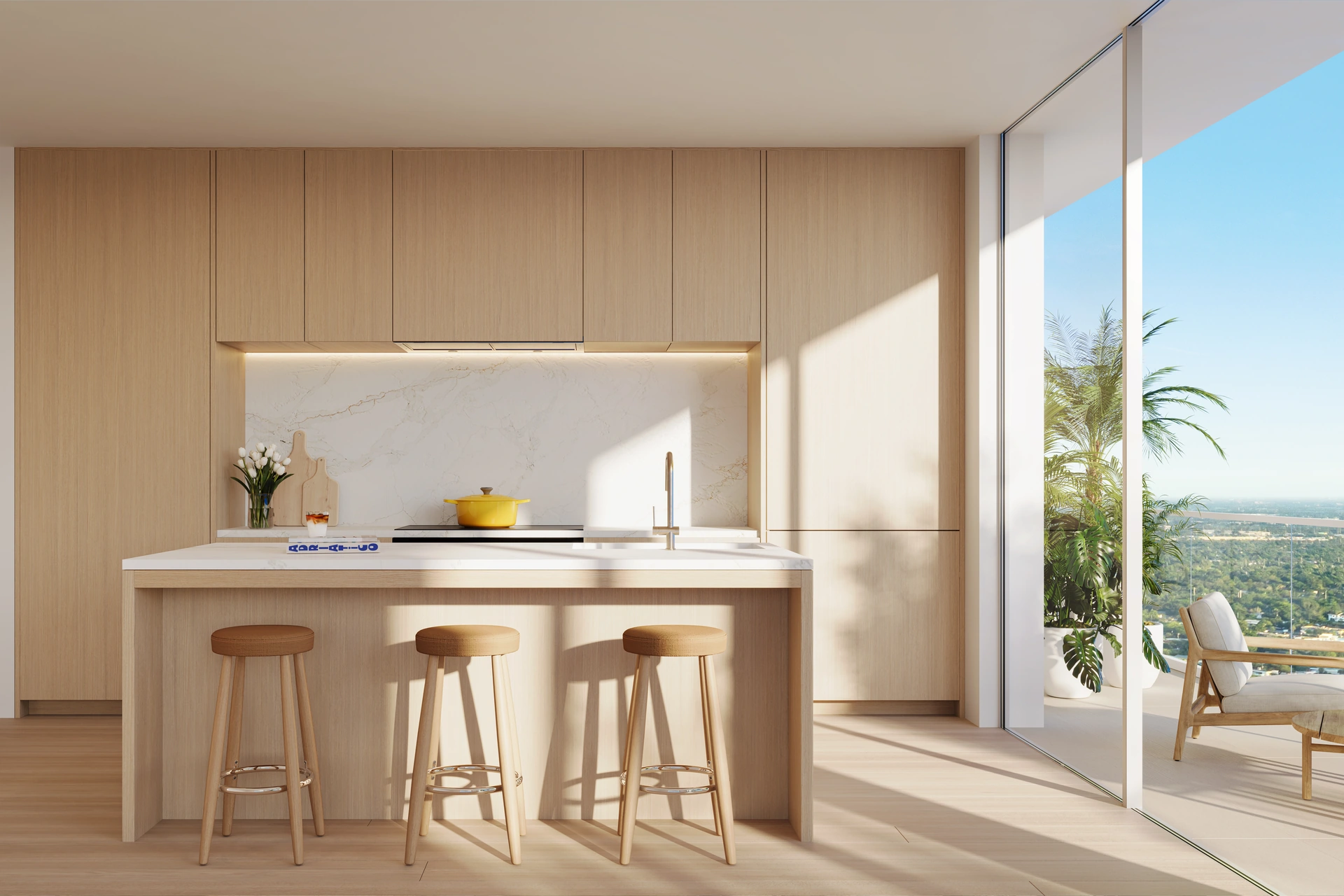 Viceroy Ft. Lauderdale — cocina con carpintería italiana en roble claro, encimera de piedra y salida corrediza a la terraza