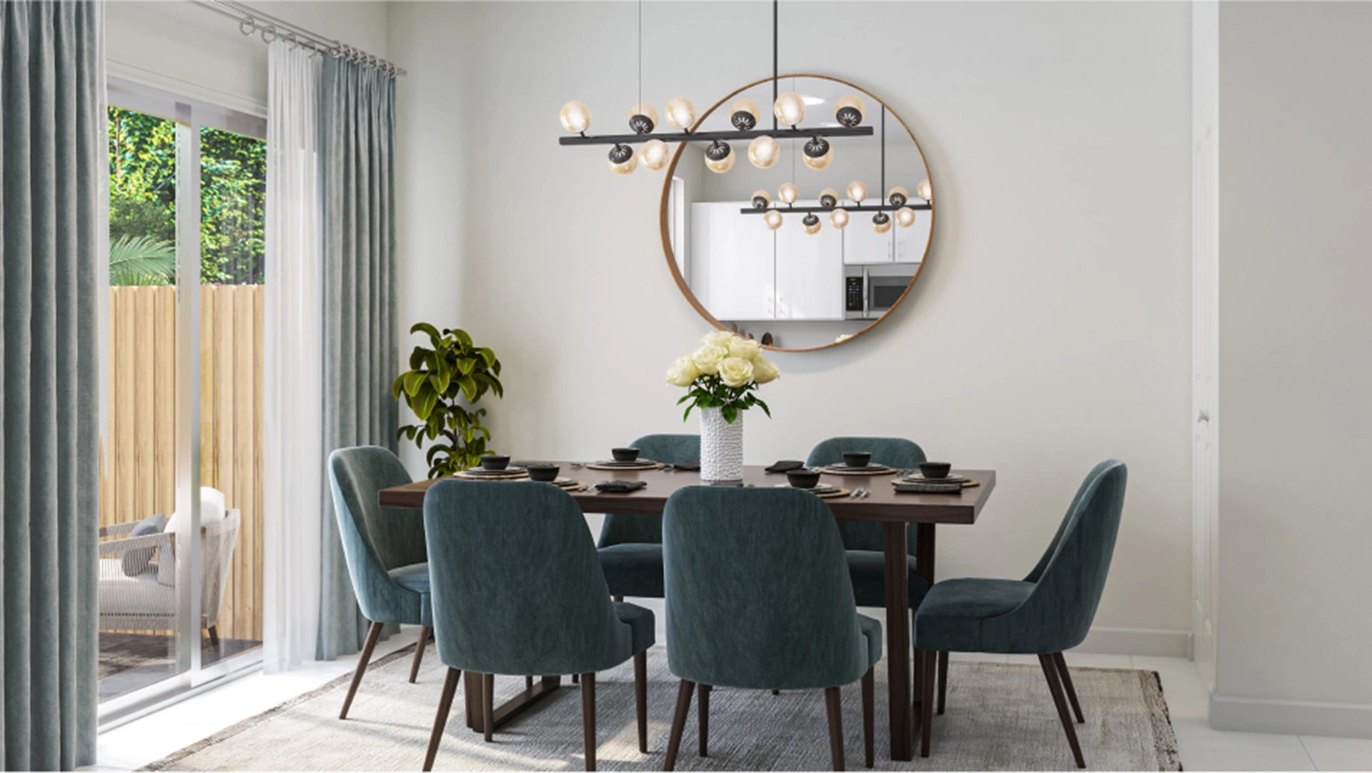 Vivant — comedor con mesa para seis y espejo circular sobre la pared