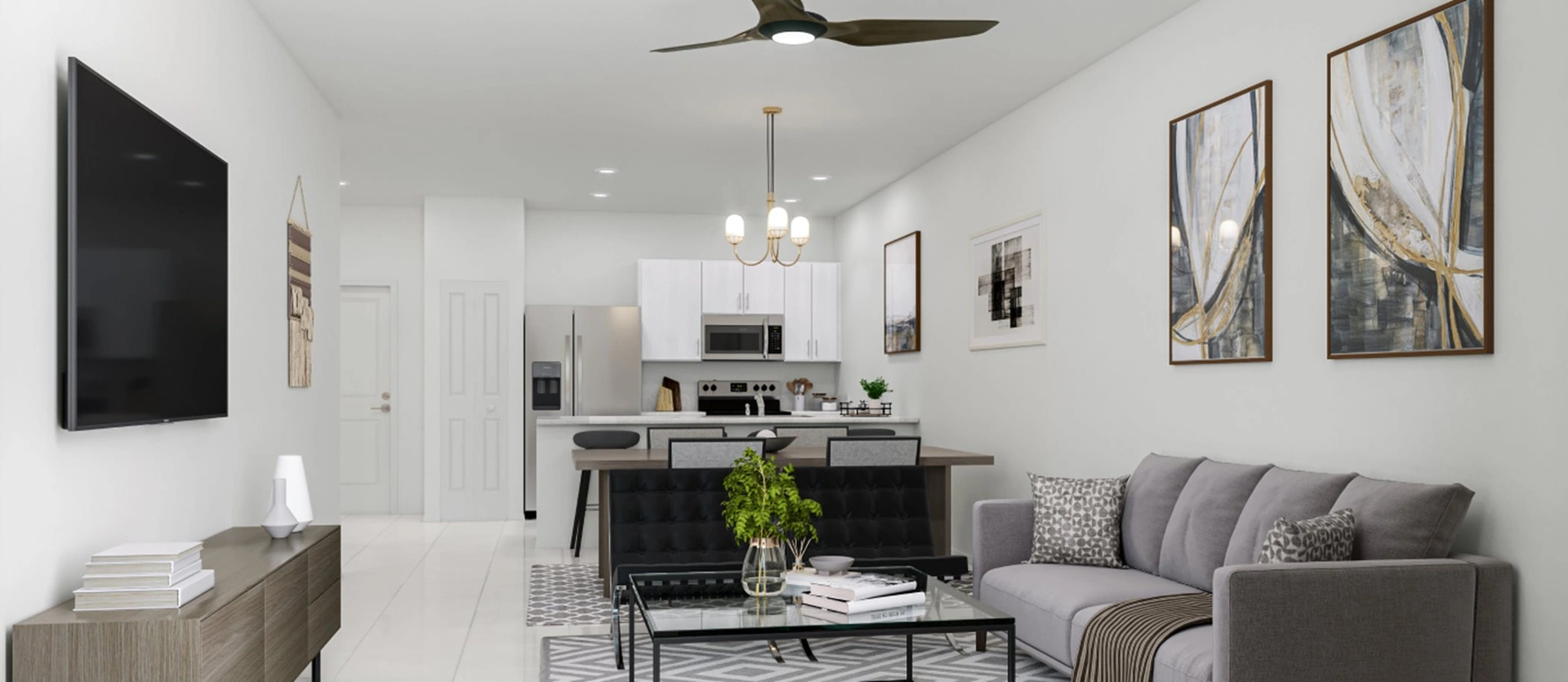 Vivant — sala con sofá y sillón, escalera al segundo piso al fondo